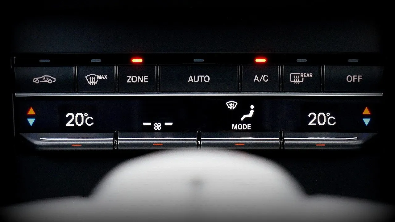 Automatic climate control panel with temperature and A/C buttons