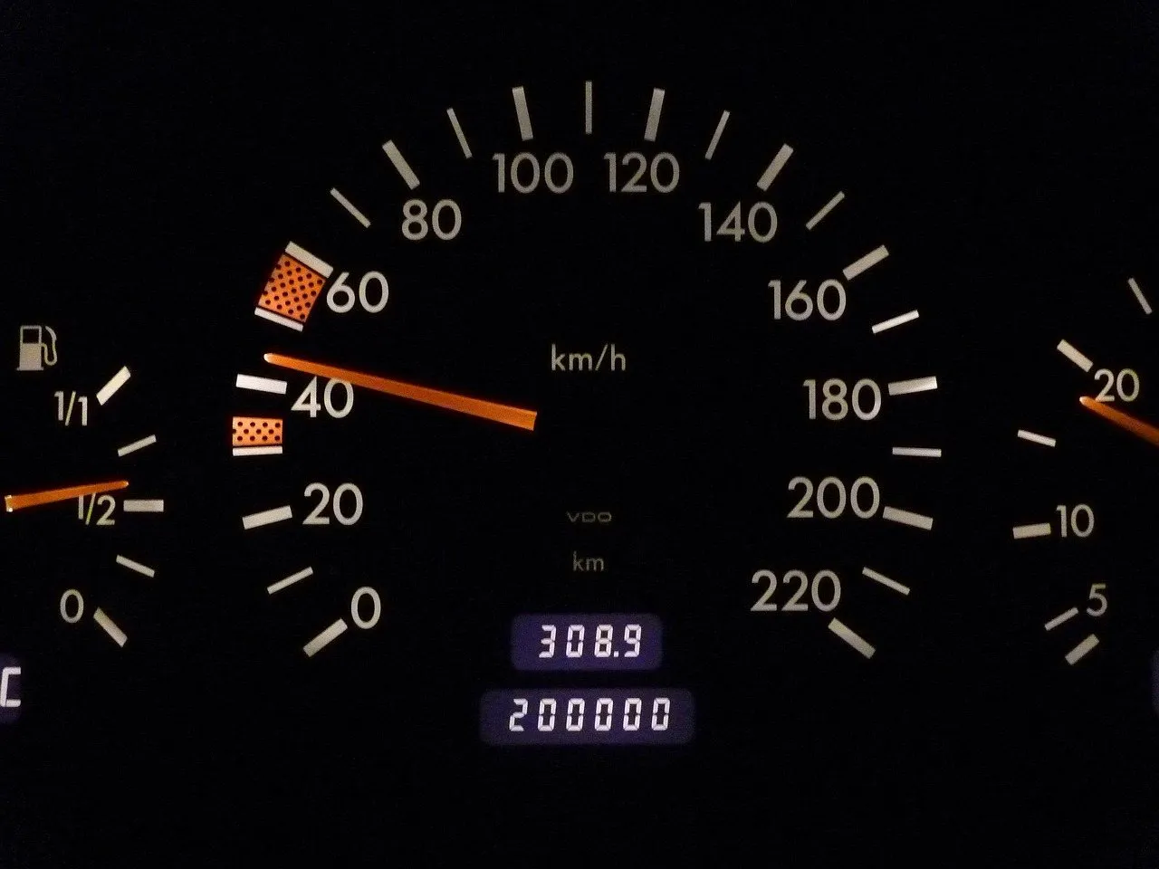 Odometer reading 200,000 kilometres on an older car